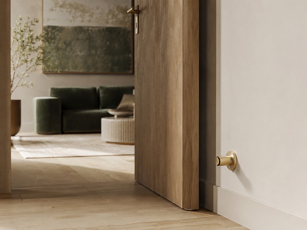 DUHAUS door bumper installed on a wall or skirting beside an internal timber door